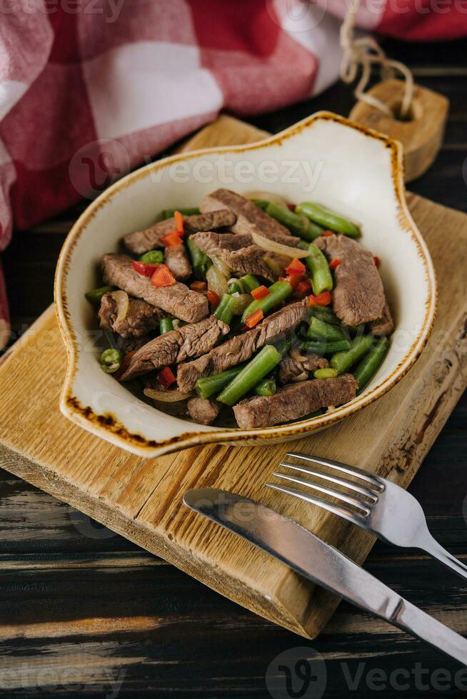 Veal with green beans and chilli pepper photo