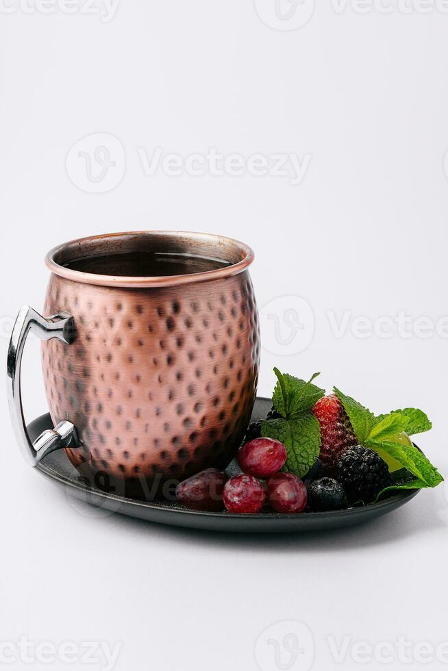 Rosehip tea with aniseed, mint and berries photo