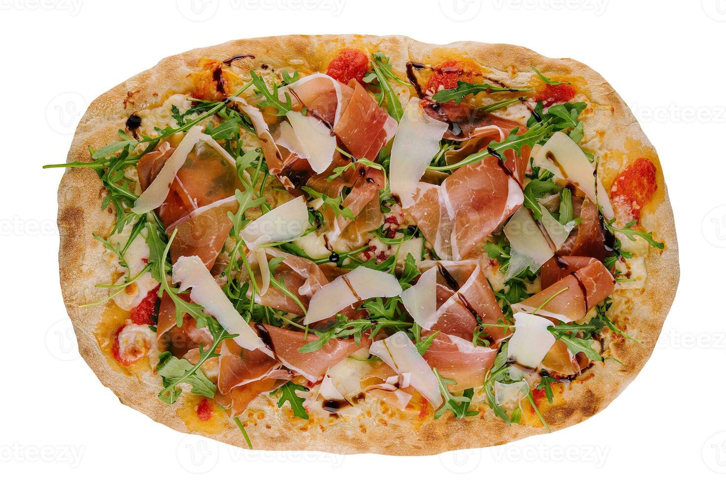 Fresh pizza Parma made of parmesan, prosciutto ham and arugula photo