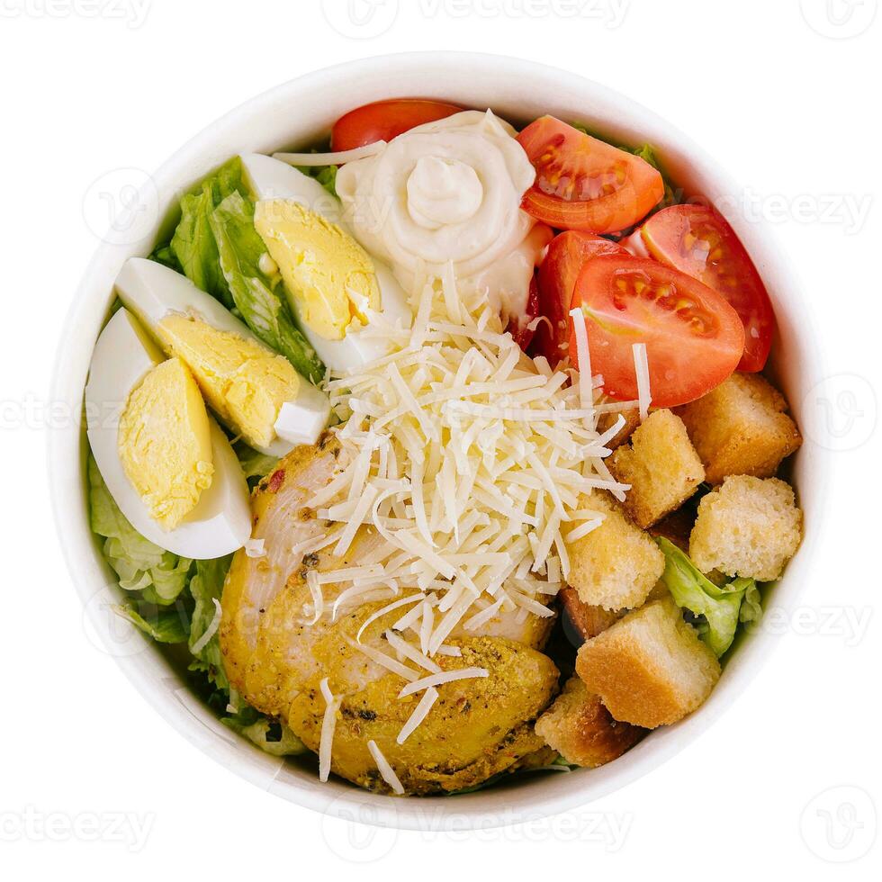 Italian caesar salad with chicken on white photo