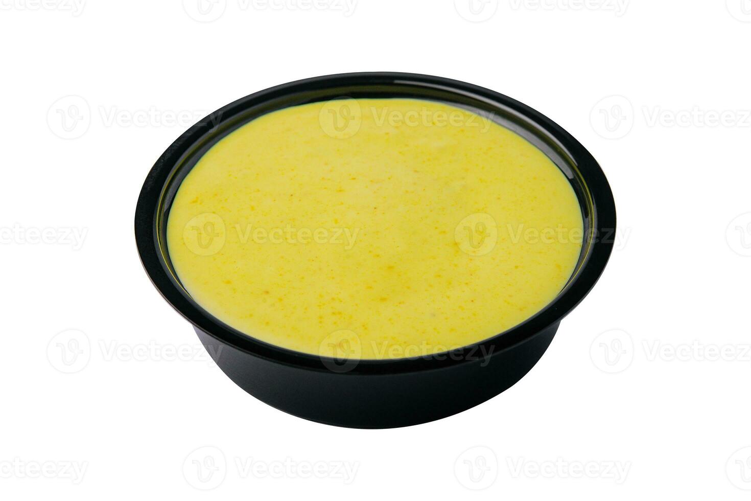 Curry sauce in a small bowl isolated photo
