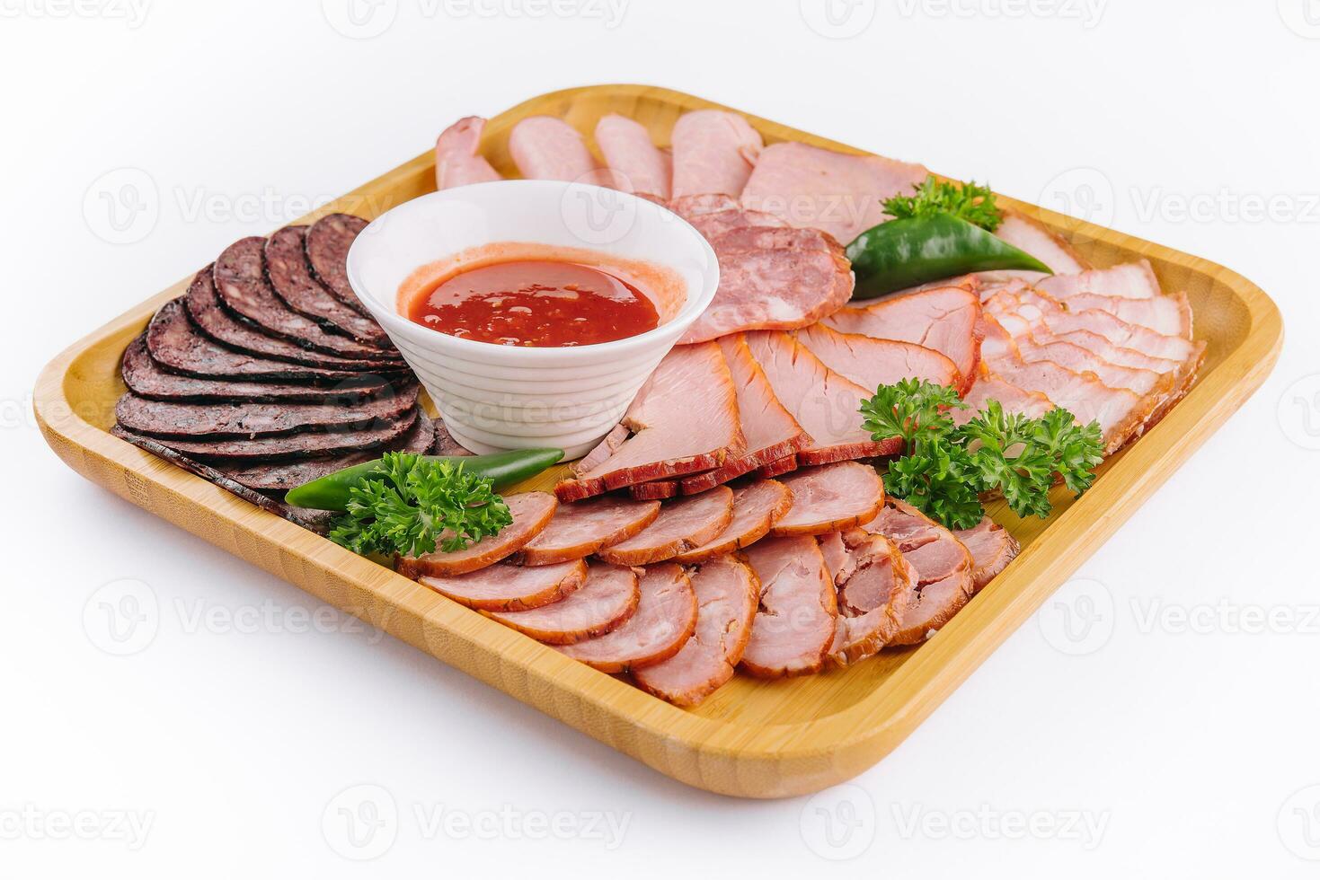 Assorted deli cold meats on wooden tray photo