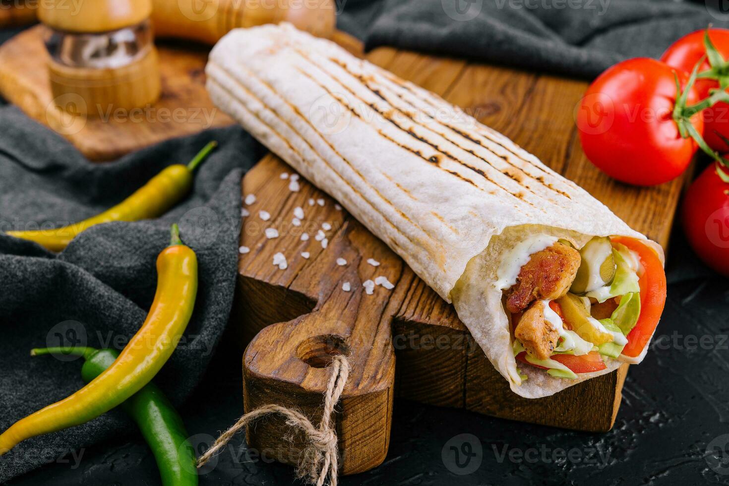 Shawarma rolled in lavash, moist grilled meat photo