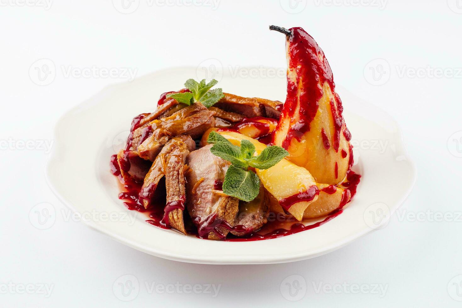 Fried duck fillet with pear on a plate photo