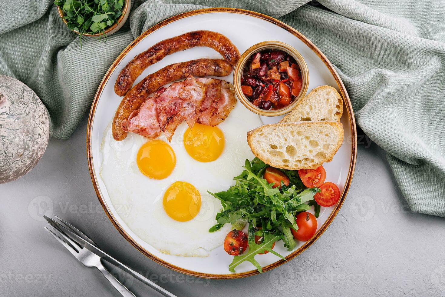 Fried eggs and bacon for breakfast on a plate photo