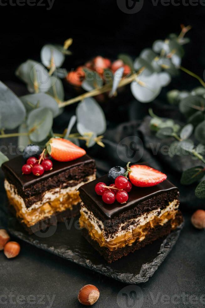 Delicious chocolate cake decorated with fresh berries photo