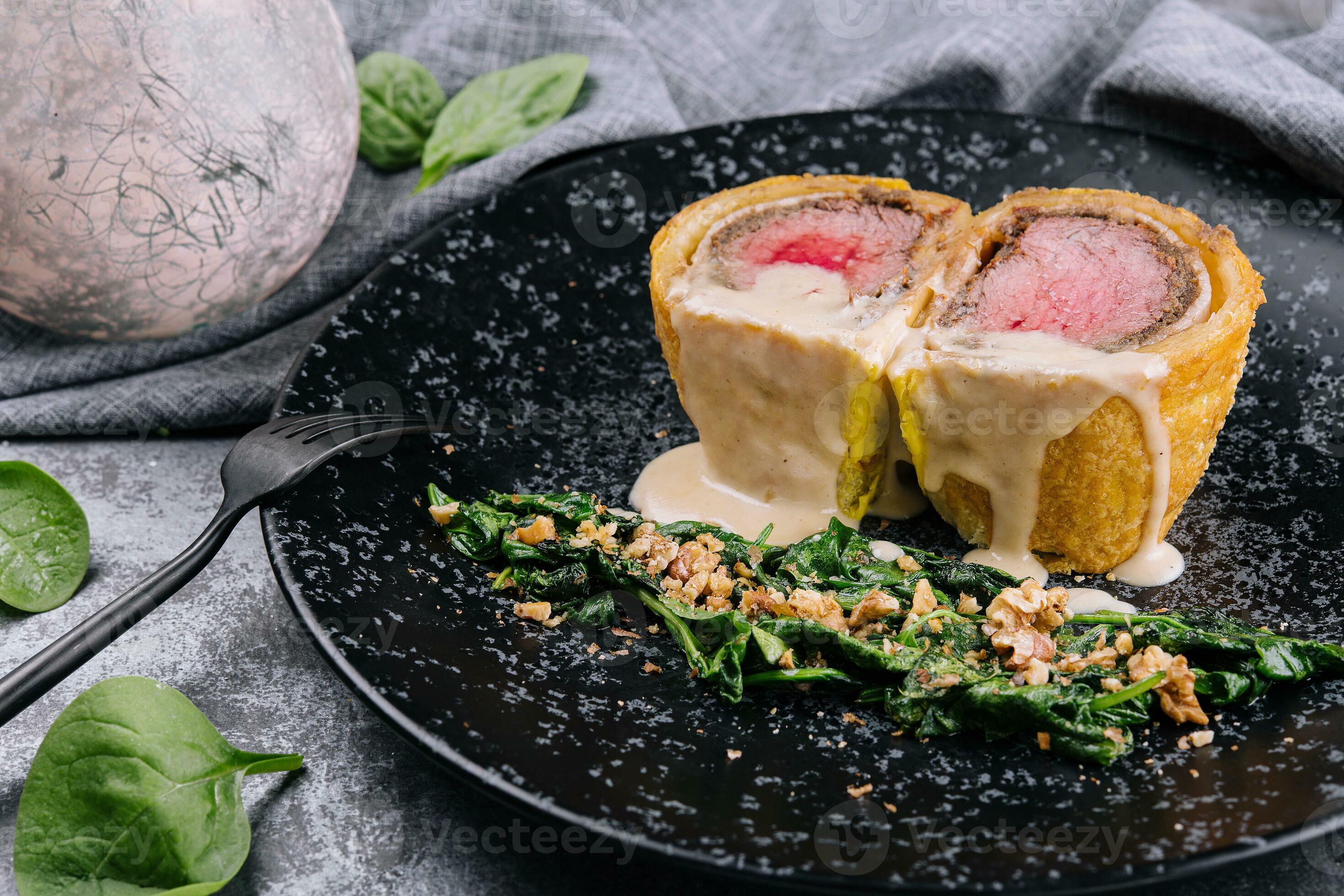Pork tenderloin en croute on black plate 30515812 Stock Photo at Vecteezy