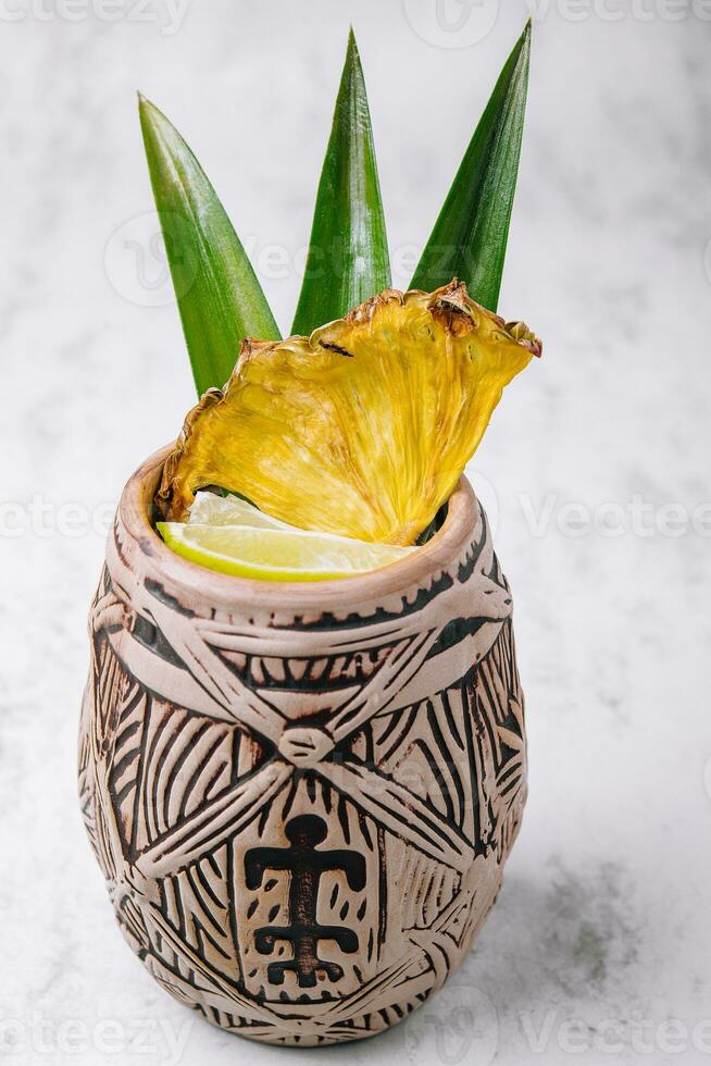 Tropical pineapple cocktail drink with lime photo