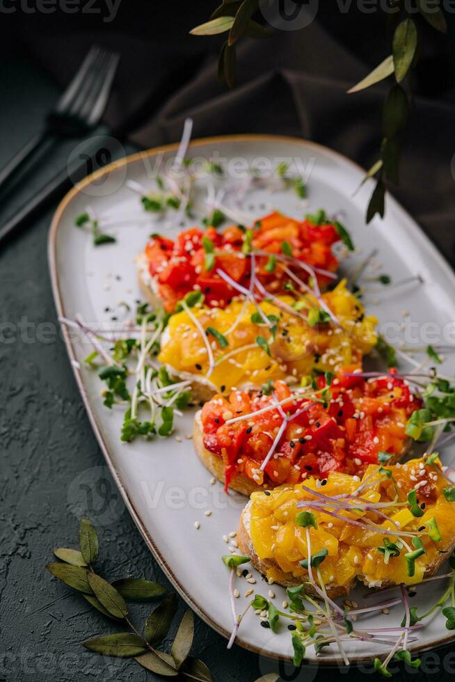 Italian bruschetta with roasted peppers goat cheese photo