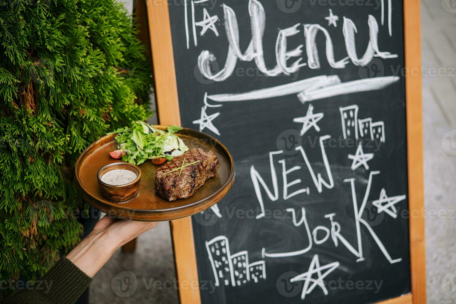 Signboard on the street. Grilled beef fillet steak photo