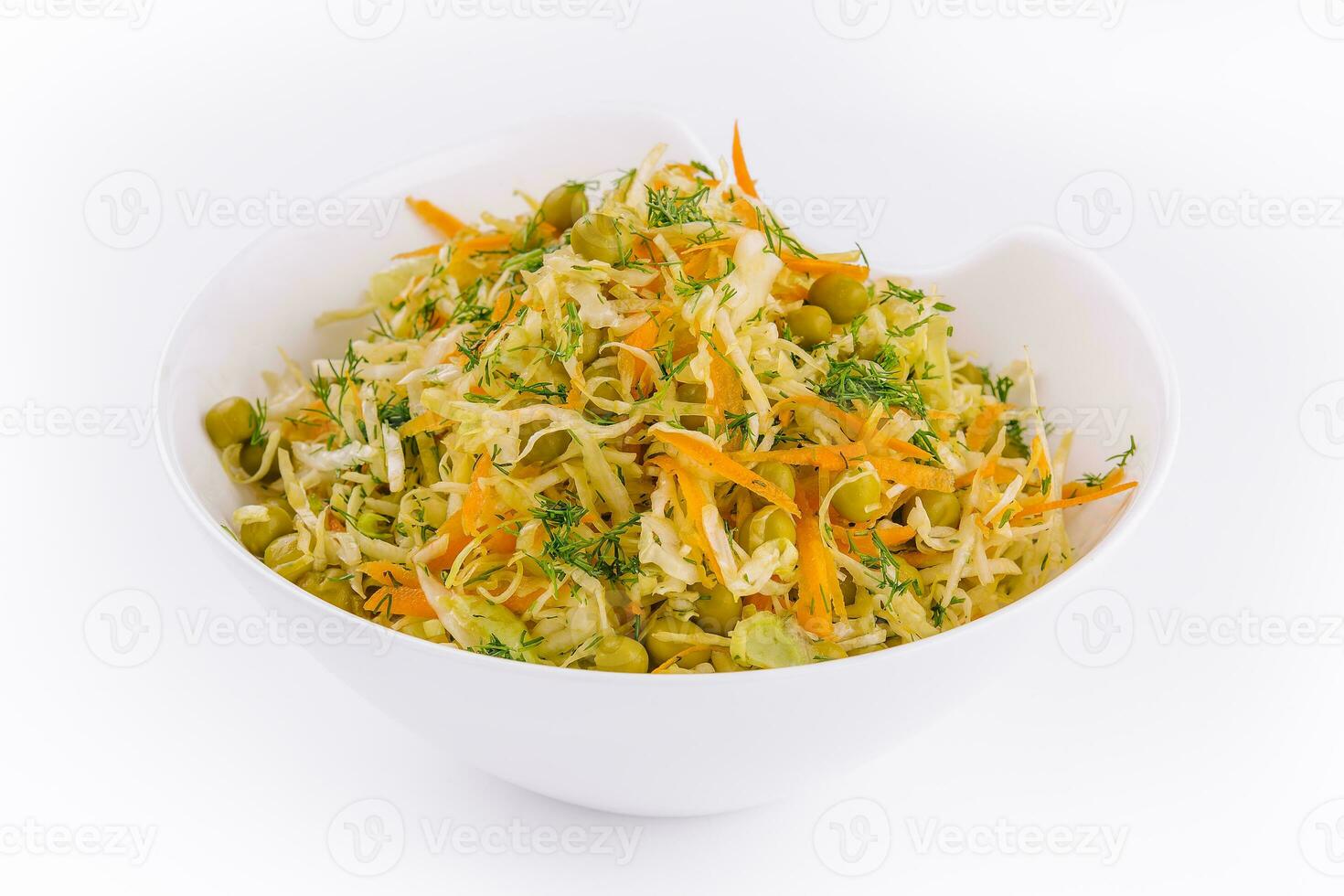 Fresh vegetables salad with cabbage carrot and green peas photo
