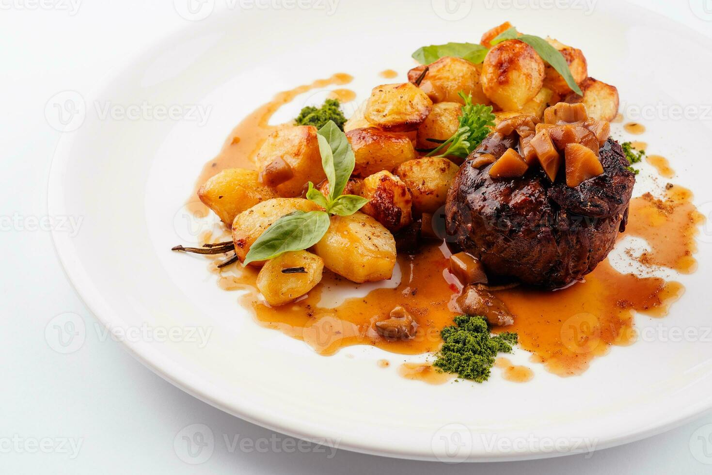 Delicious grilled beef medallion with fried potatoes photo