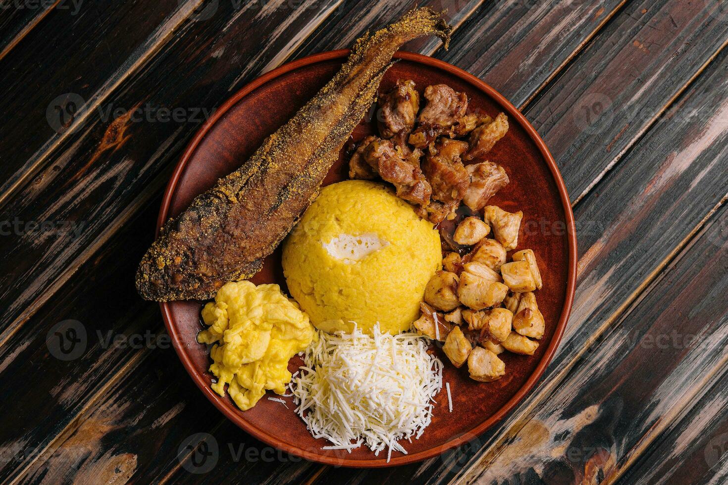 Traditional Moldavian hominy porridge on a wooden tray photo