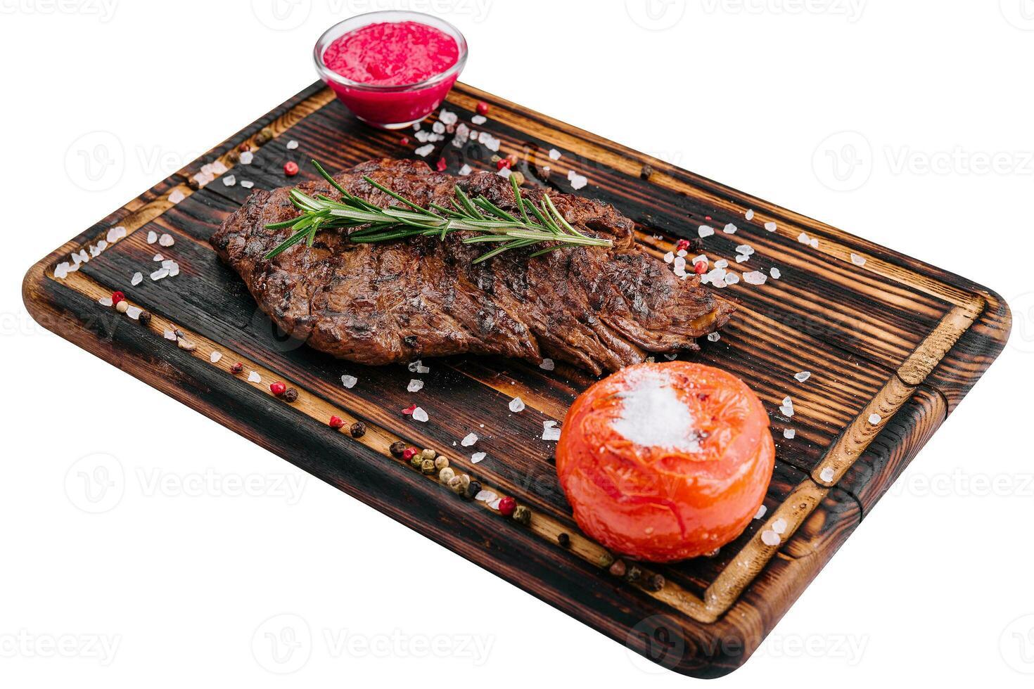 Grilled beef steak on wooden board photo