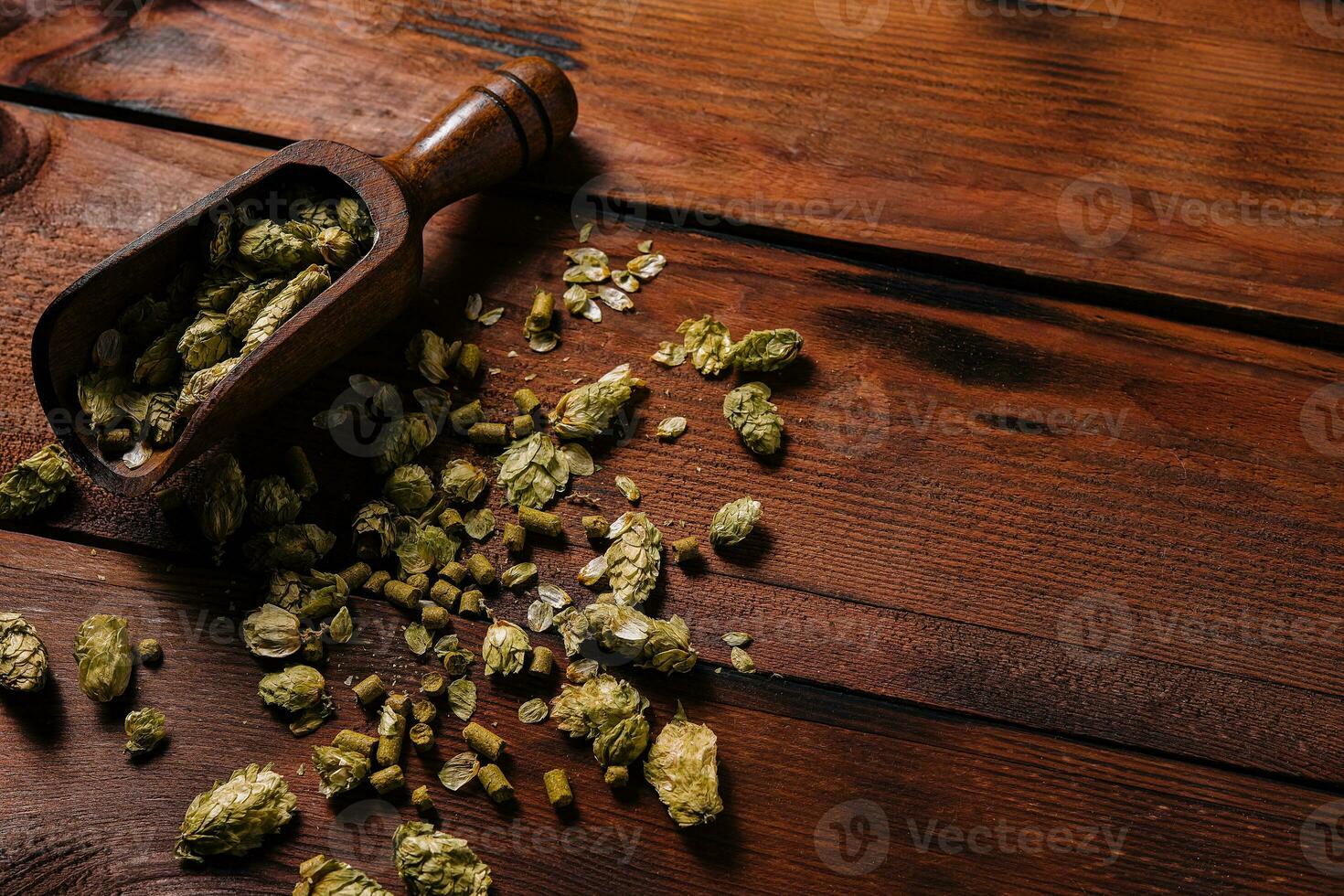 Fresh green hops on wooden table photo
