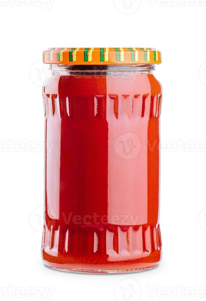 Tasty tomato sauce in glass jar isolated on white photo