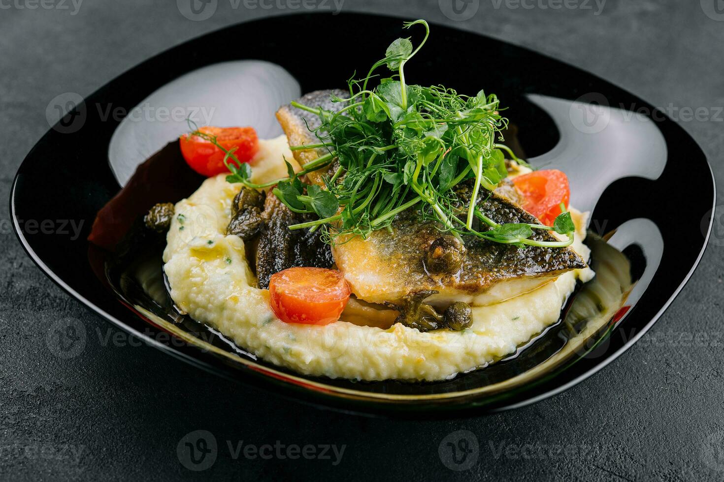 Fried norwegian skrei cod fish filet with mashed potatoes photo