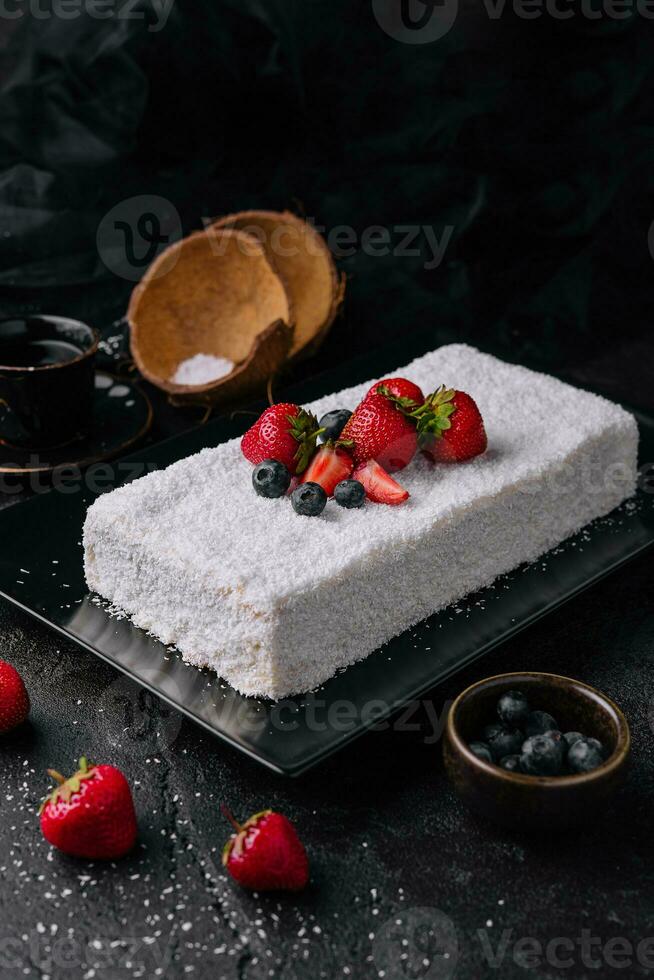 raffaello cake coconut almond cake with berries photo