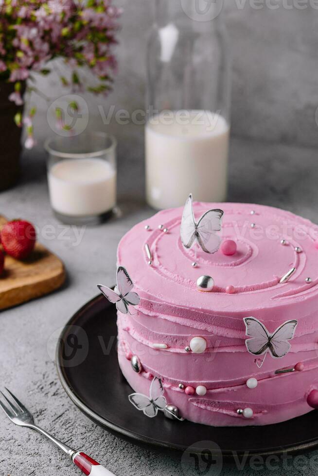 pink cake decoration in the form of butterflies photo