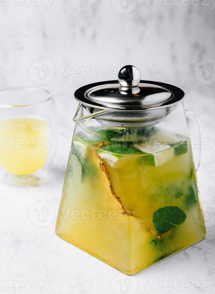 Passionfruit iced green tea or lemonade with lime and mint photo