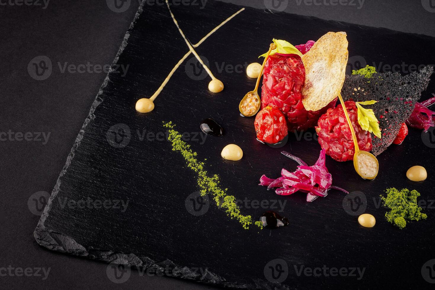 Beef tartare with various dip and vegetables photo