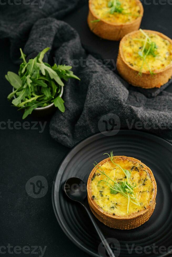 Plate of many mini bite size quiche appetizers photo