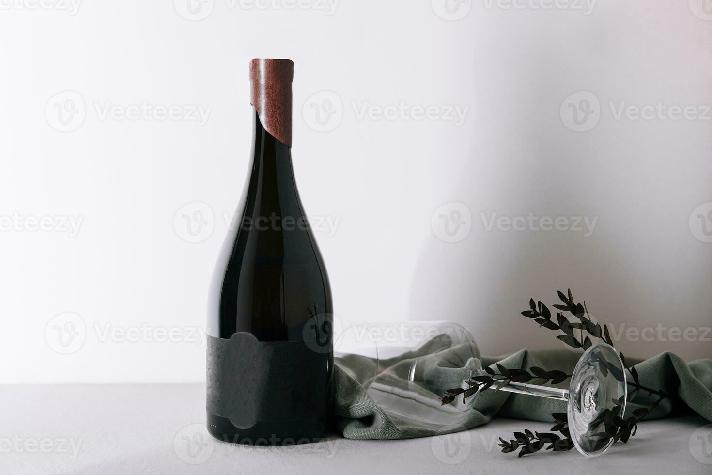 Glass and bottle of red wine photo