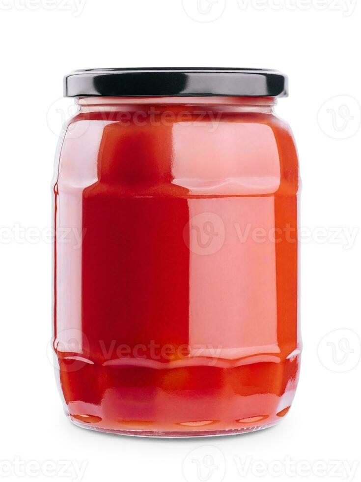 Tasty ketchup in glass jar isolated on white photo