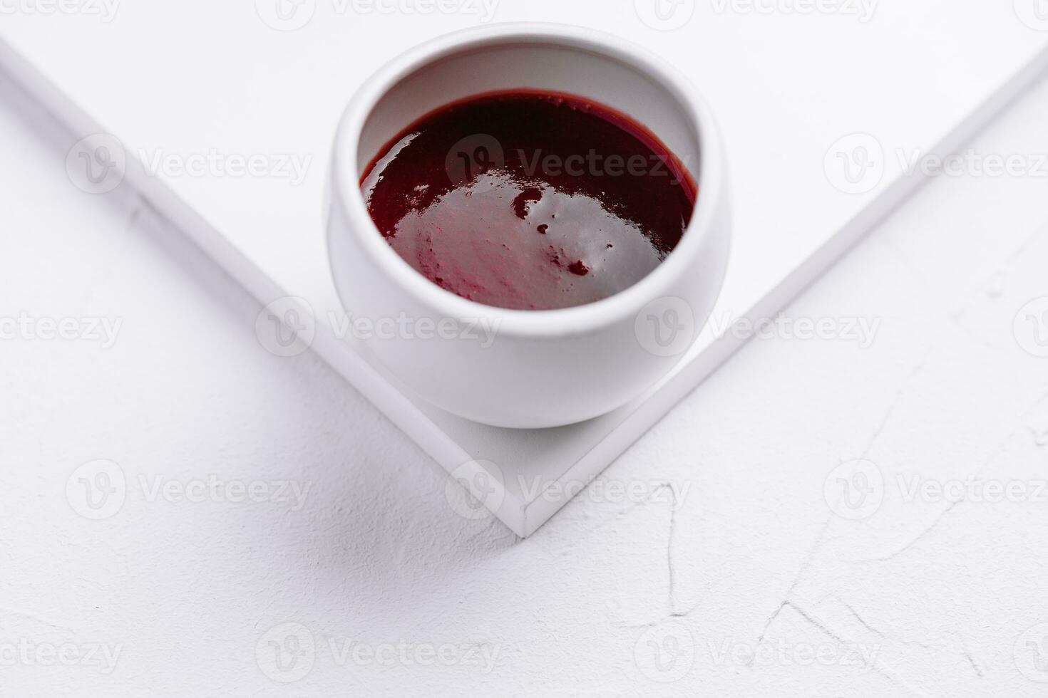 jar of red berry jam isolated photo