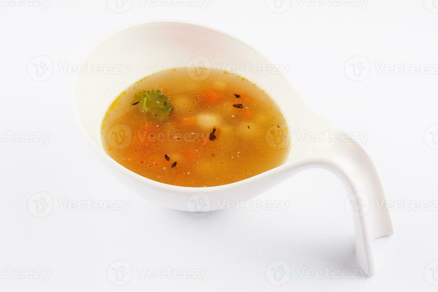 Plate of chicken soup isolated over white photo