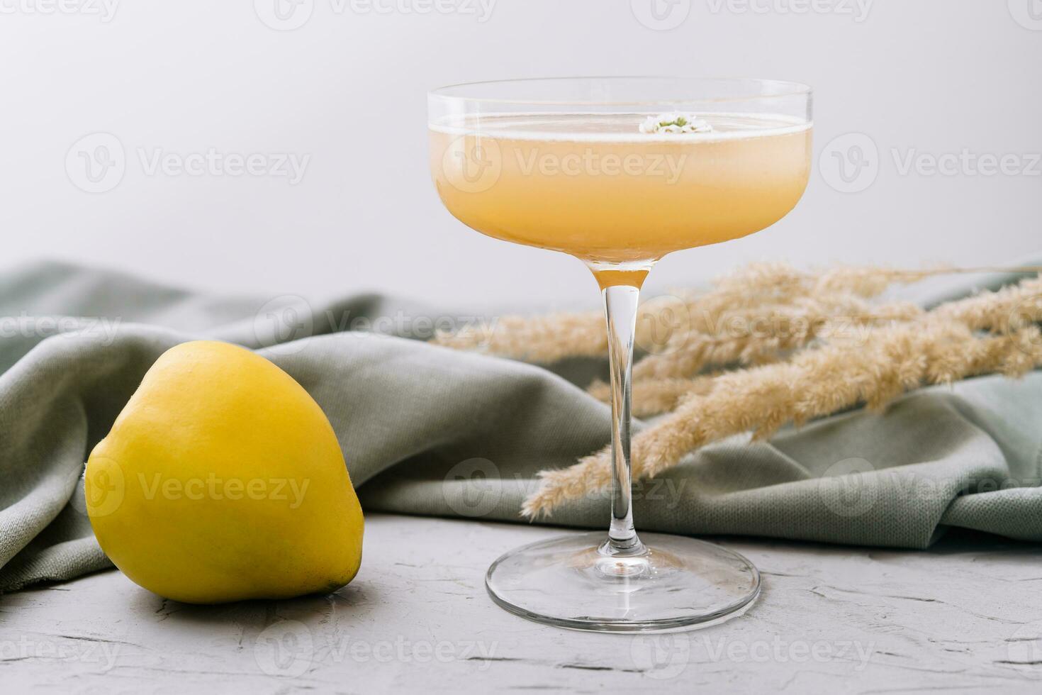 quince cocktail in a glass isolated photo