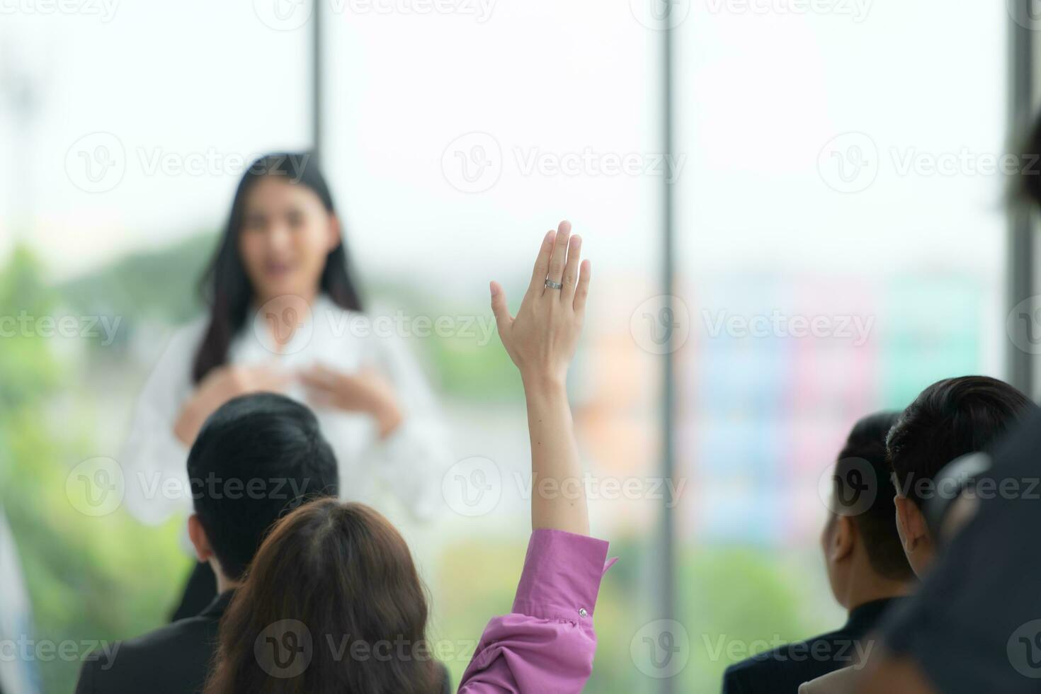 A group of business people organizes a seminar. Discuss the success of doing business in a technology-driven era. photo