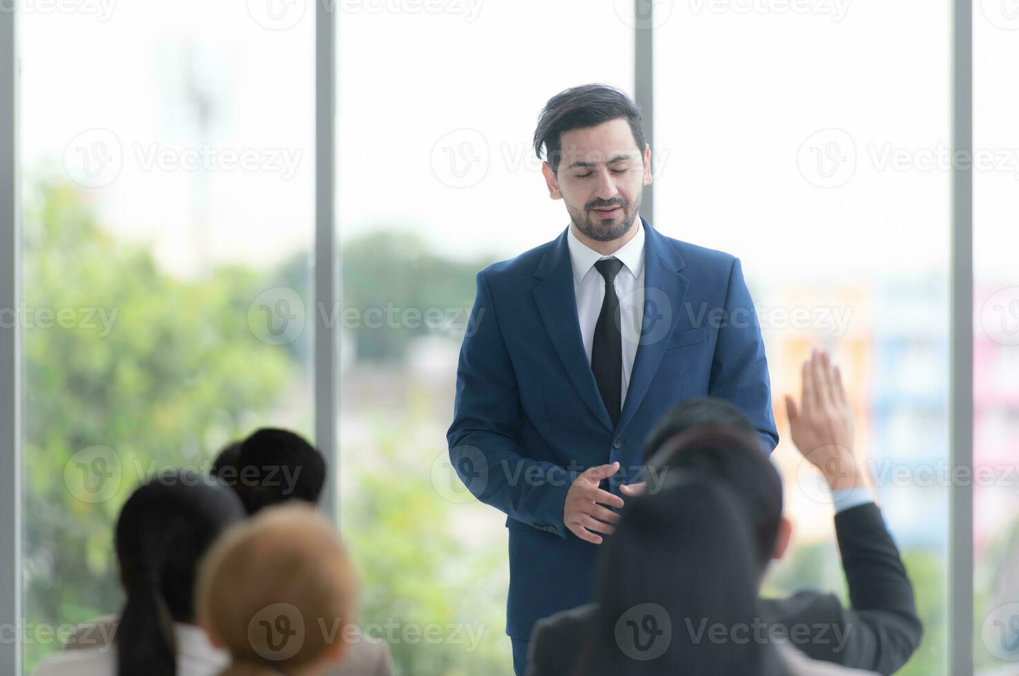 A group of business people organizes a seminar. Discuss the success of doing business in a technology-driven era. photo