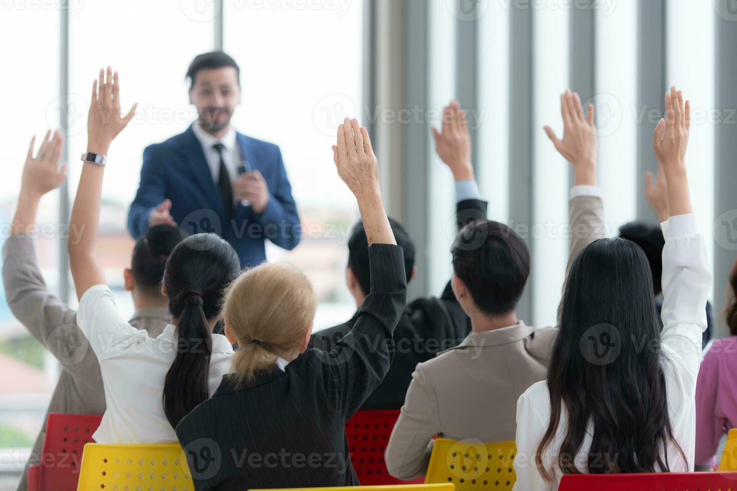 A group of business people organizes a seminar. Discuss the success of doing business in a technology-driven era. photo