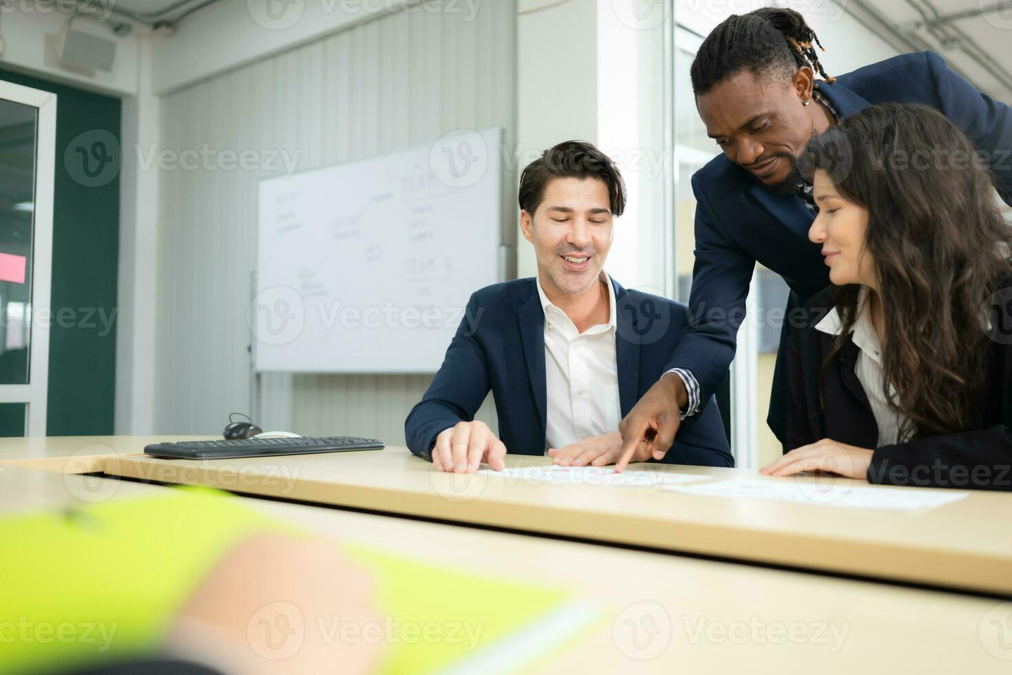 Group of business people working together in a meeting at the office. photo