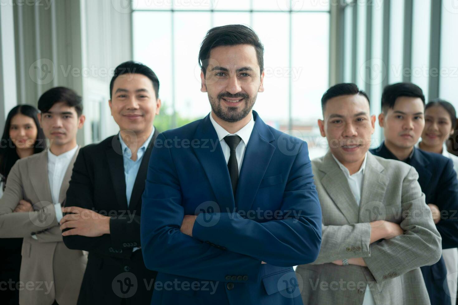 Group of business people standing in line in conference room used for meeting in modern office photo