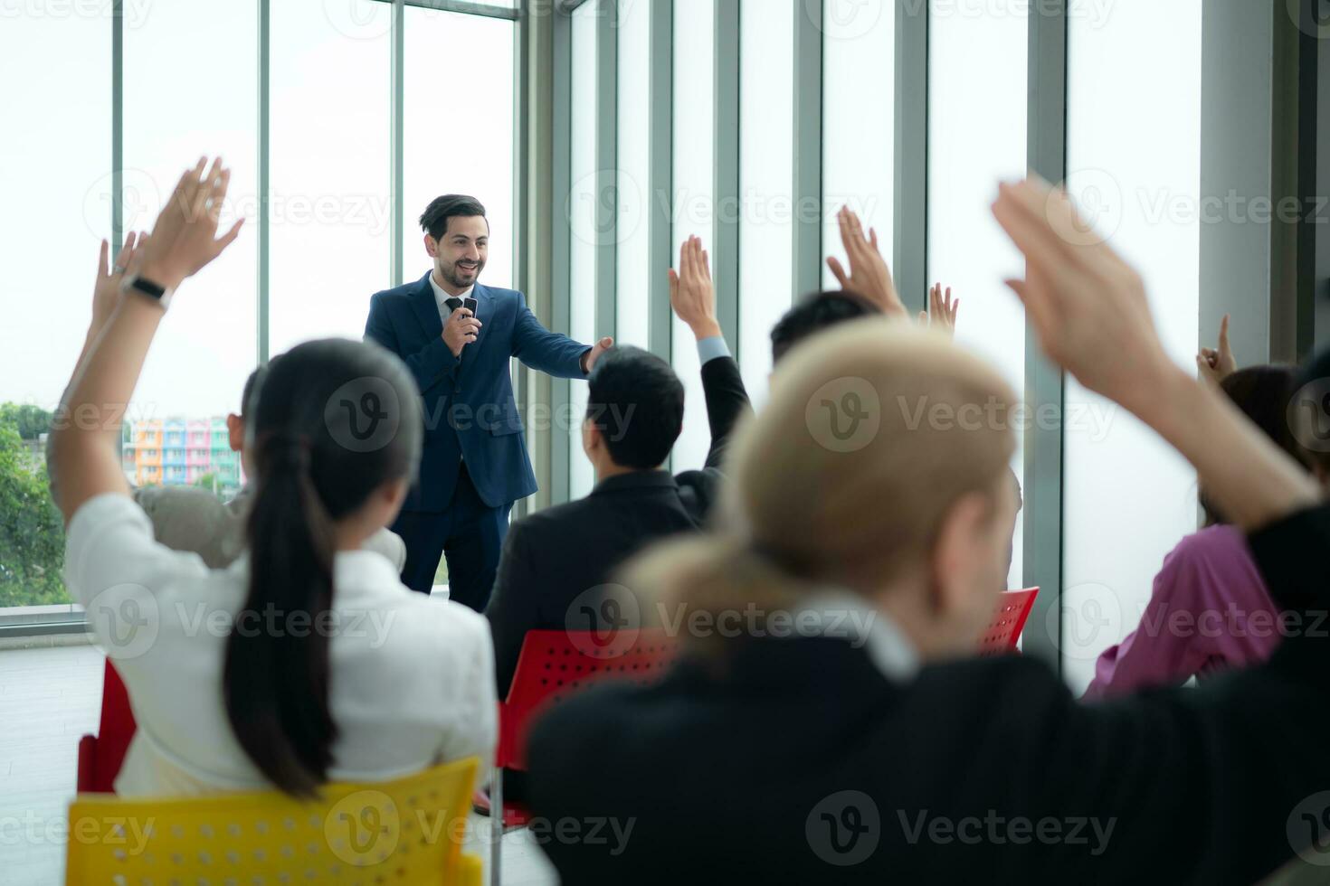 A group of business people organizes a seminar. Discuss the success of doing business in a technology-driven era. photo