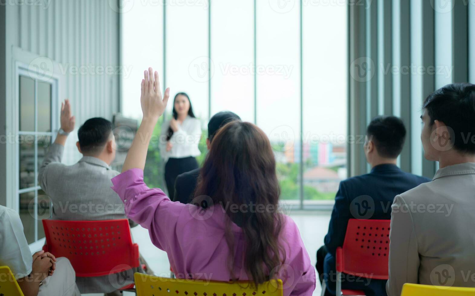 A group of business people organizes a seminar. Discuss the success of doing business in a technology-driven era. photo