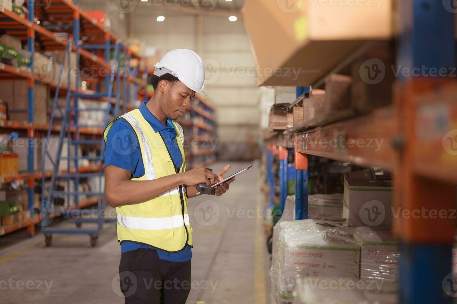 Portrait of smiling male warehouse worker using digital tablet in a warehouse photo