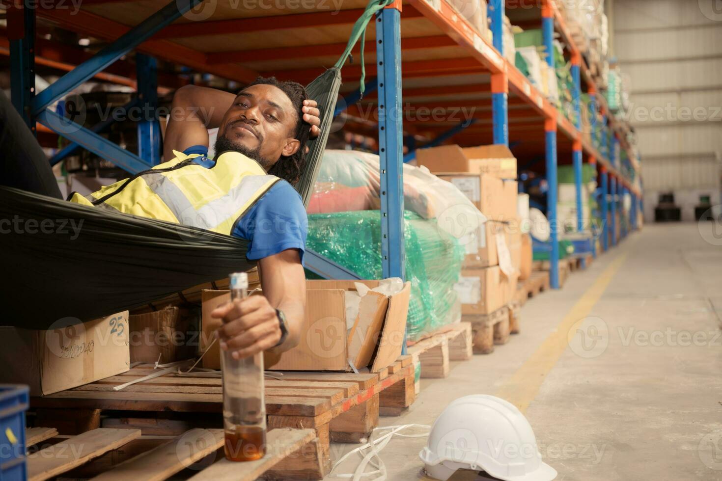 Portrait of happy mature African American man working in warehouse. This is a freight transportation and distribution warehouse. Industrial and industrial workers concept photo