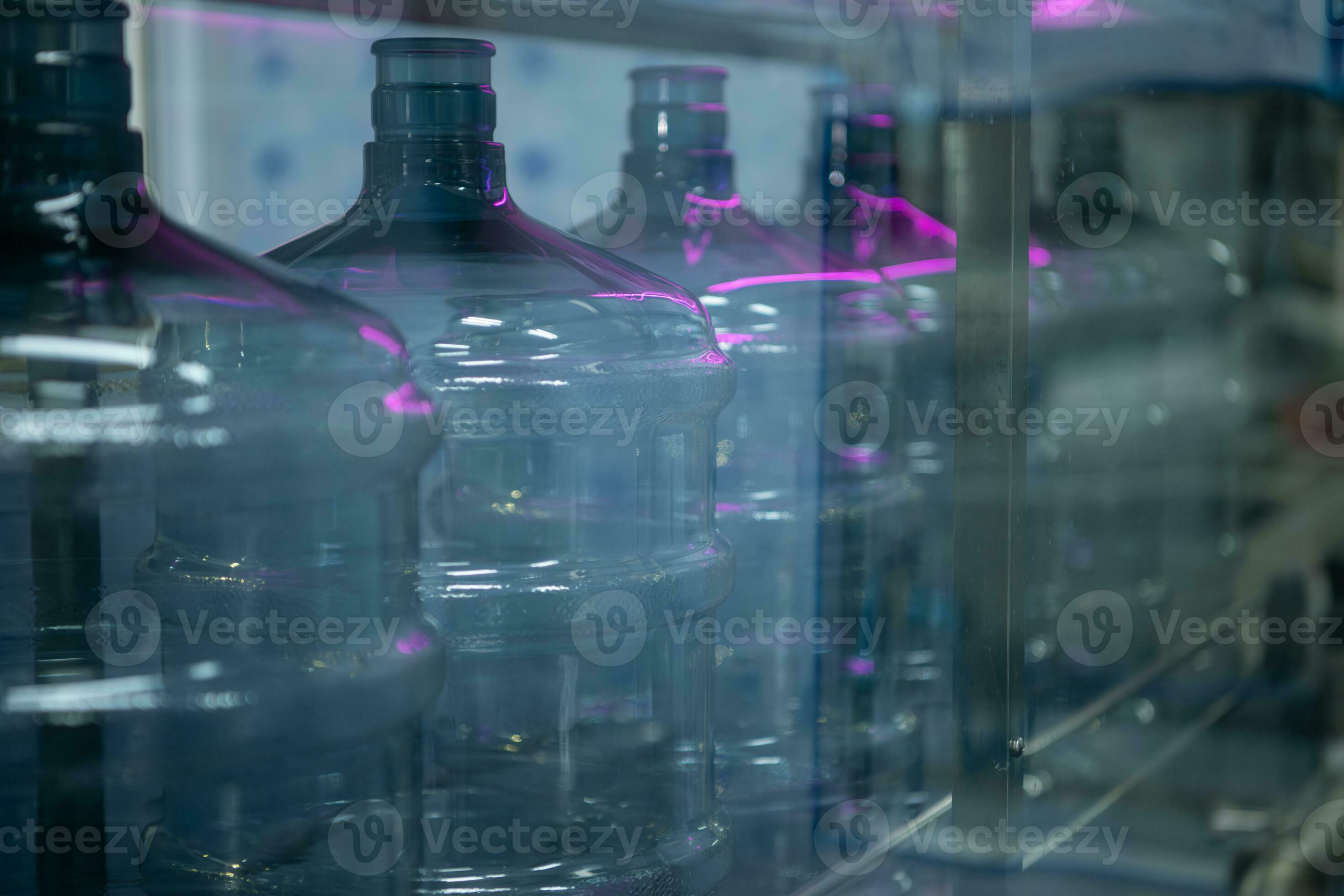 Bottles are sterilized before being transferred to the water filling