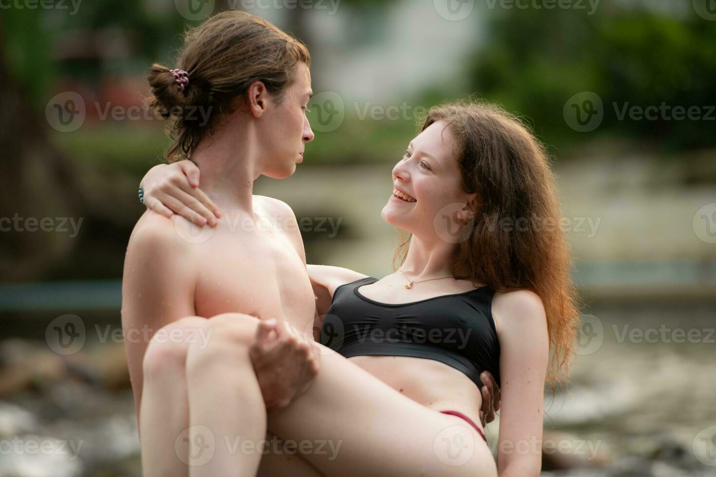 Young couple in love on the beach. Young man and woman in love on vacation photo