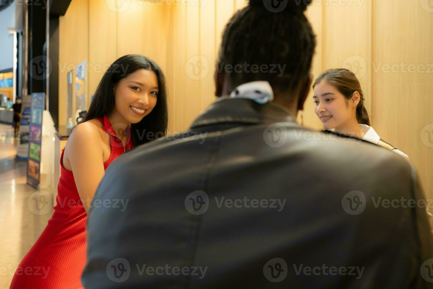 Asian ticket seller at the box office with the service of selling movie tickets to movie audiences in each round photo