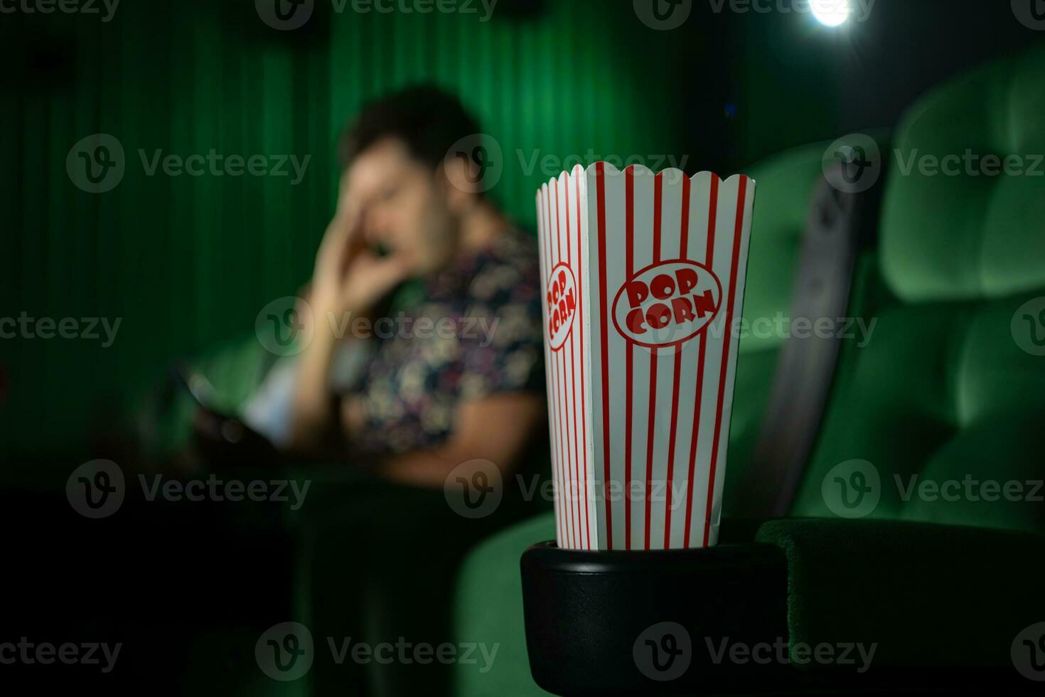 Cinema concept. People watching movie at cinema eating popcorn photo