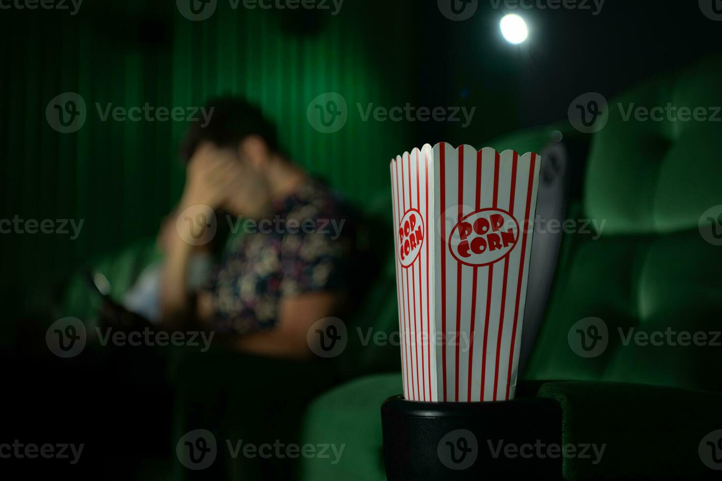 Cinema concept. People watching movie at cinema eating popcorn photo