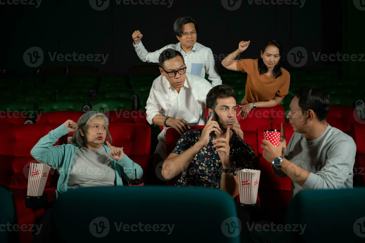 Movie etiquette, Do not talk on the phone while in the cinema, Group recreation and entertainment concept. photo