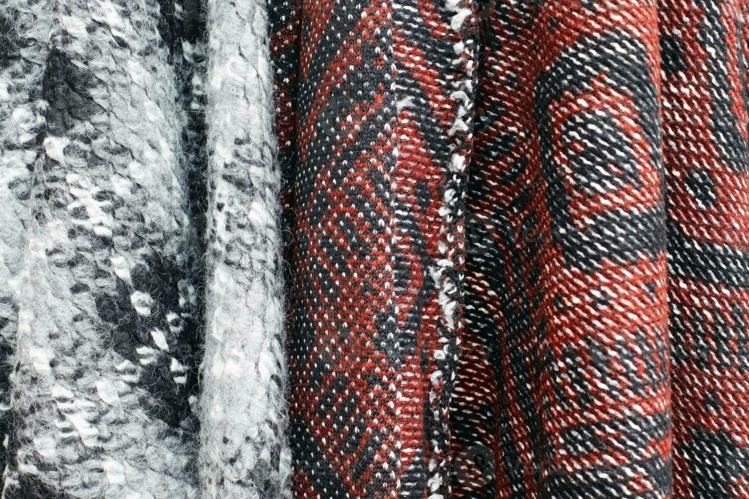Detailed close up view on samples of cloth and fabrics in different colors found at a fabrics market photo
