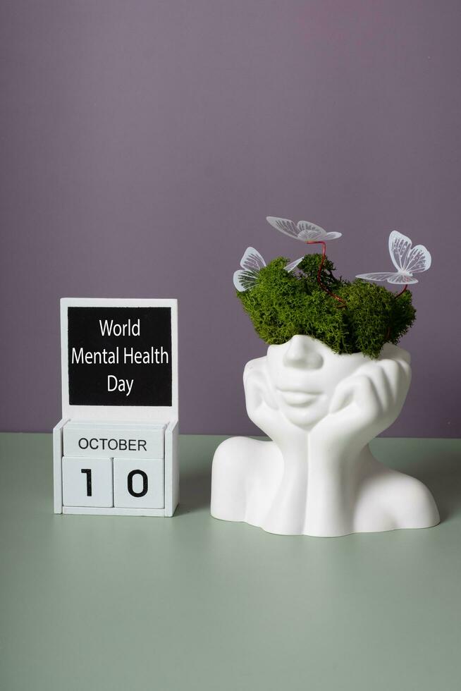 October 10 is World Mental Health Day. Head figurine with abstract filling photo