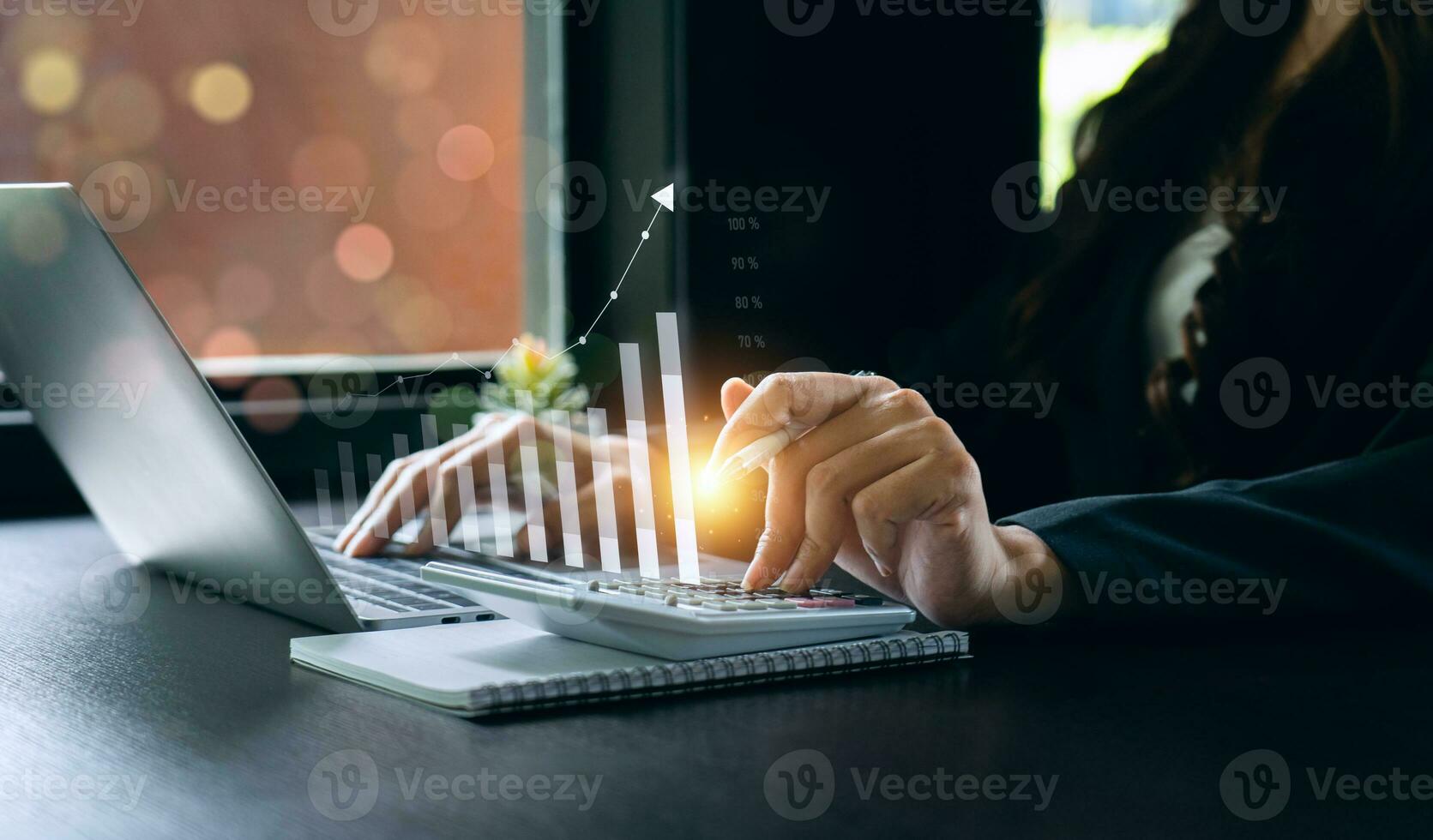 businesswoman using laptop and analyzing economic growth, financial graph and business investment. planning strategy, stock market statistics, stock market trends, technical analysis strategy, value photo