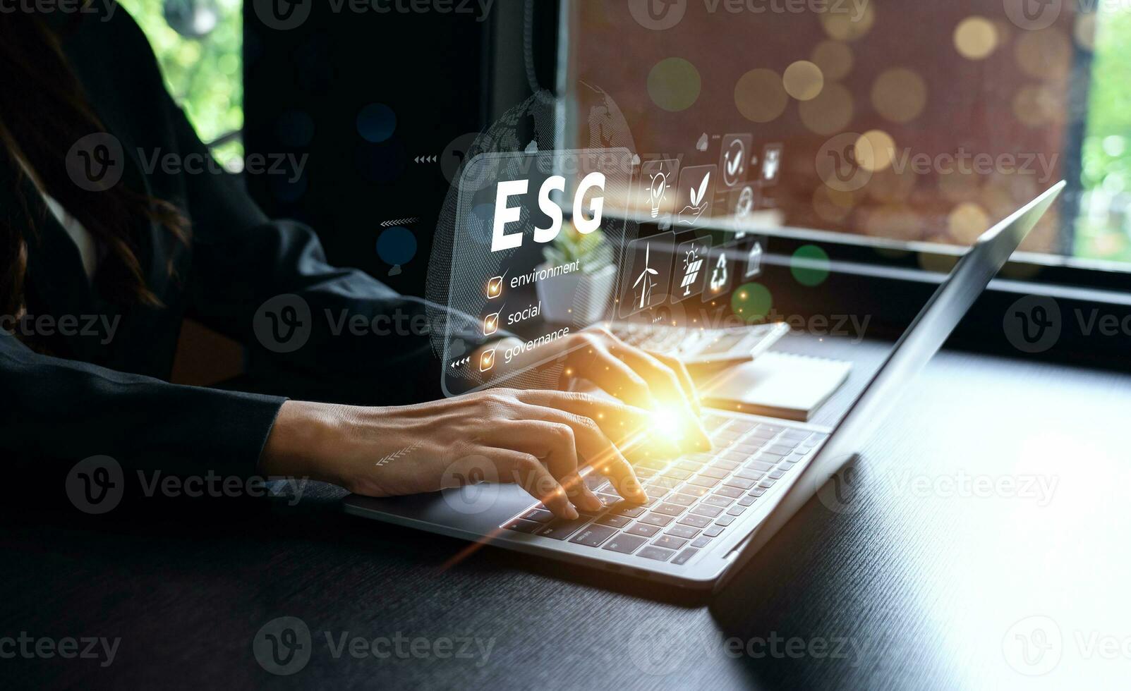 ESG environment social governance investment concept. Businessman using computer to analyze investment ESG. strategy that considers the environmental, company carbon labor practices, sustainability photo